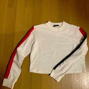 Cropped white top with green/red stripes down the sleeve